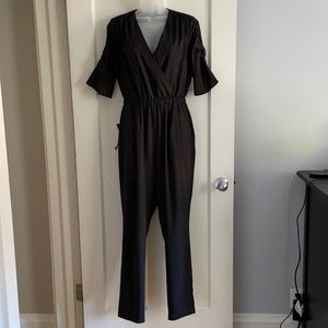 Stunning black Bebe jumpsuit with all the details!